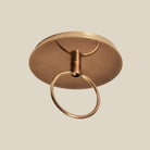 Close up of Woven Augusta Pendant on a beige background at Addison West