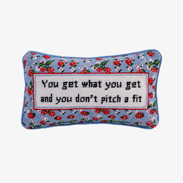 Small needlepoint pillow by Furbish that says 'you get what you get and you don't pitch a fit' on a white background