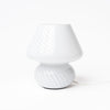 White glass hand blown lamp on a white background