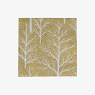 Cocktail napkin with white tree pattern on a gold background