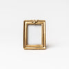 Small rectangular picture frame with gold leaf and bee detail on a white background