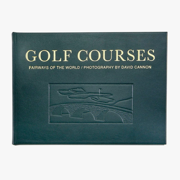 Green leather bound version of book 'Golf courses: faireways of the world' by Graphic Image on a white background