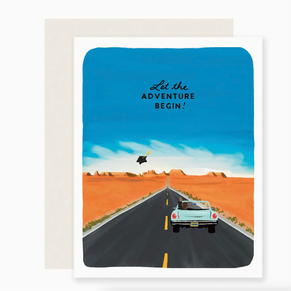Greeting card with drawing of car on desert highway and graduation cap thrown in the air. Words say 'let the adventure begin!'