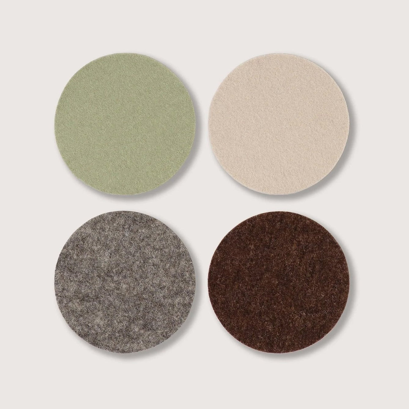 Graf Lantz Merino Wool Round Coaster Multi 4 Pack in Hearth on a white background at Addison West