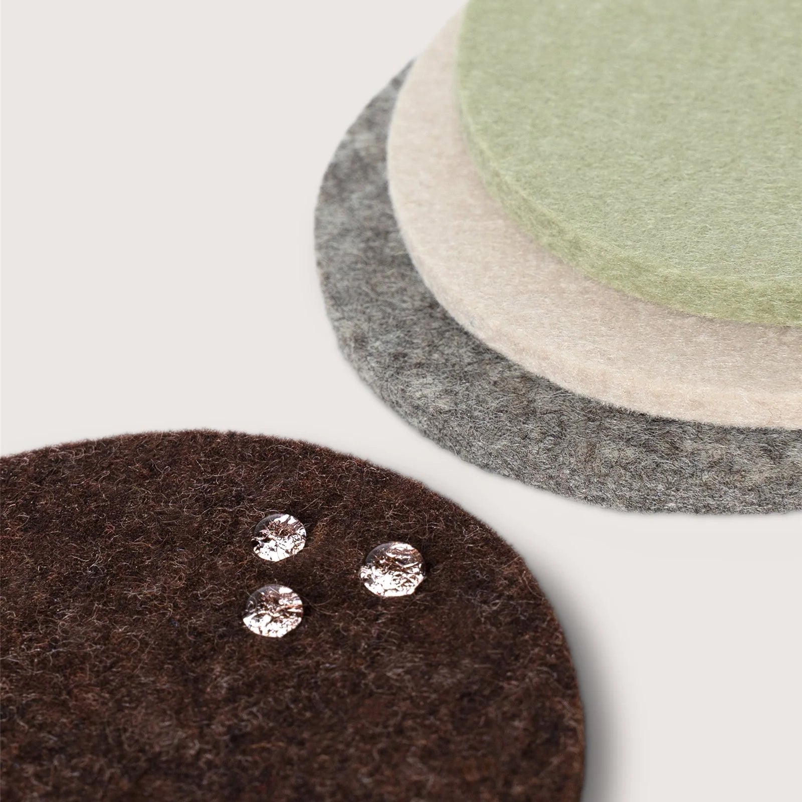Graf Lantz Merino Wool Round Coaster Multi 4 Pack in Hearth on a white background at Addison West