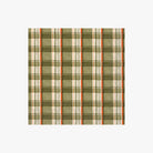 Plaid cocktail napkin with green, beige, and orange pattern on a white background