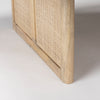 Close up of Grier 42" Square Light Brown Wood with Cane Coffee Table on a white background