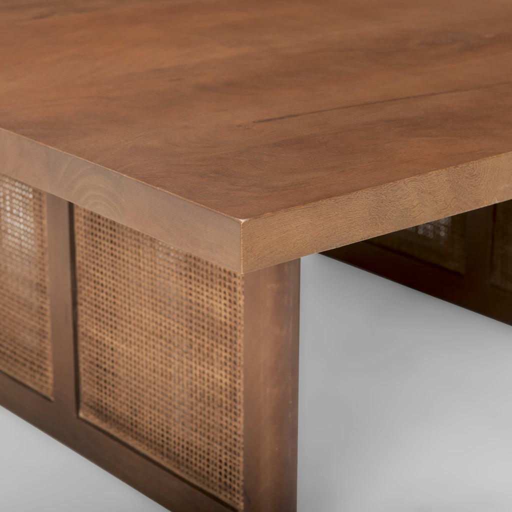 Close up of Grier 42" Square Medium Brown Solid Wood with Cane Coffee Table on a white background