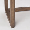 Close up of legs of Grier Medium Brown Solid Wood with Cane Office Desk on a white background
