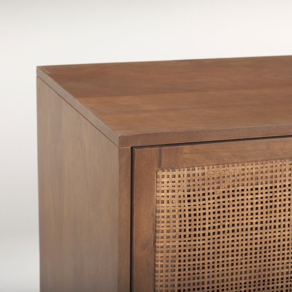 Close up of Grier Medium Brown Solid Wood with Cane Media Console on a white background