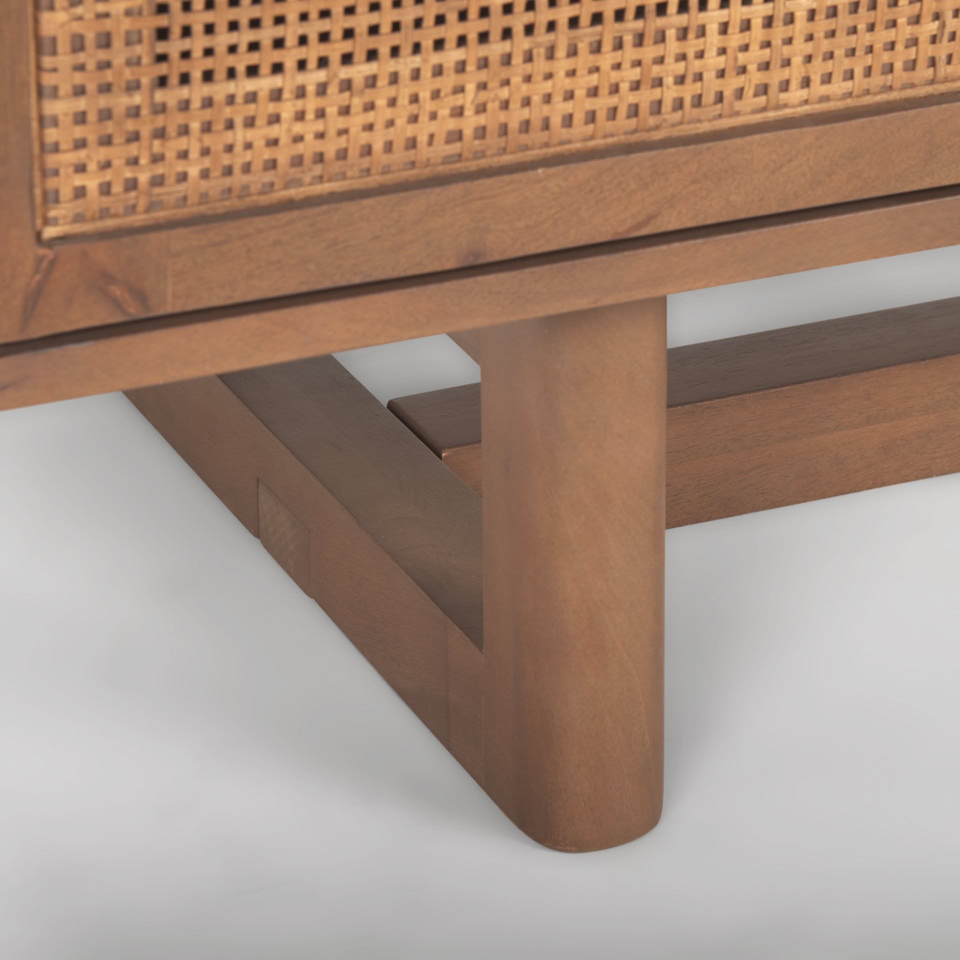 Close up of Grier Medium Brown Solid Wood with Cane Media Console on a white background