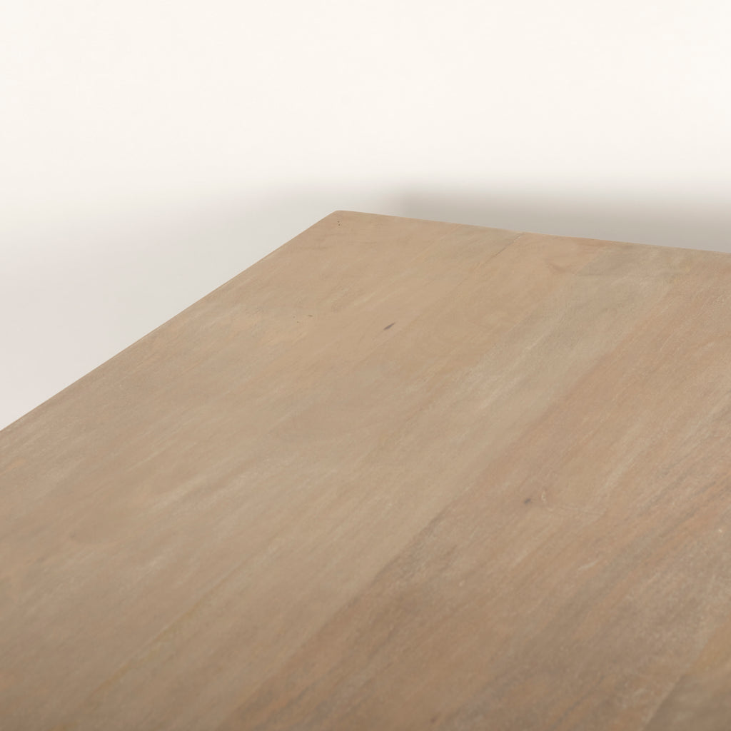 Close up of Grier 84 inch long Light Brown Wood with Cane Dining Table on a white background