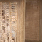Close up of Grier 84 inch long Light Brown Wood with Cane Dining Table 