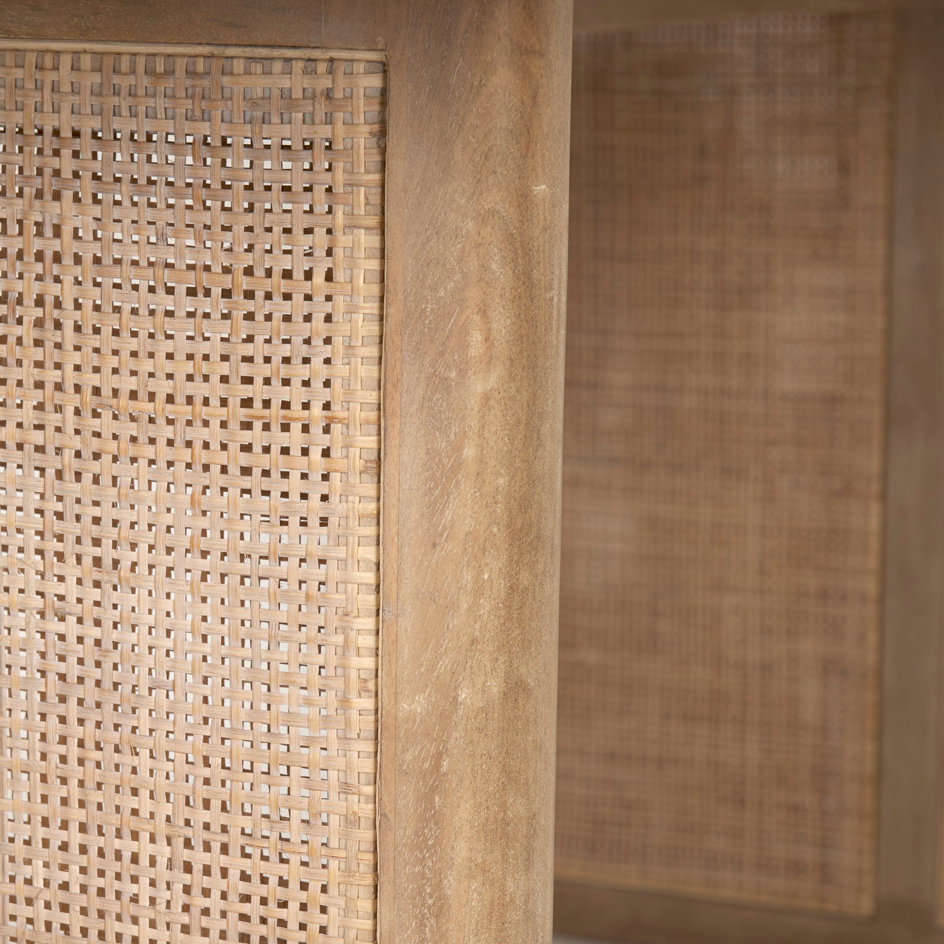 Close up of Grier 84 inch long Light Brown Wood with Cane Dining Table 