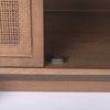 Close up of Grier Medium Brown Solid Wood with Cane Sideboard on a white background