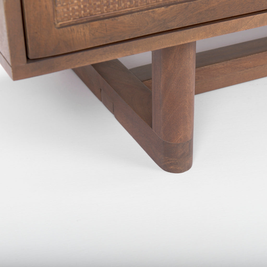 Close up of Grier Medium Brown Solid Wood with Cane Sideboard on a white background