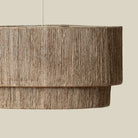 Close up of Cocktail 2 Tier Jute Pendant on a beige background at Addison West