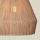 Close up of Collins Jute Pendant on a beige background at Addison West