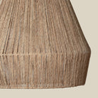 Close up of Collins Jute Pendant on a beige background at Addison West