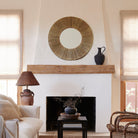 Highball Jute Round Mirror in a living room at Addison West