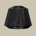 Manhattan Jute Pendant in Black on a beige background at Addison West