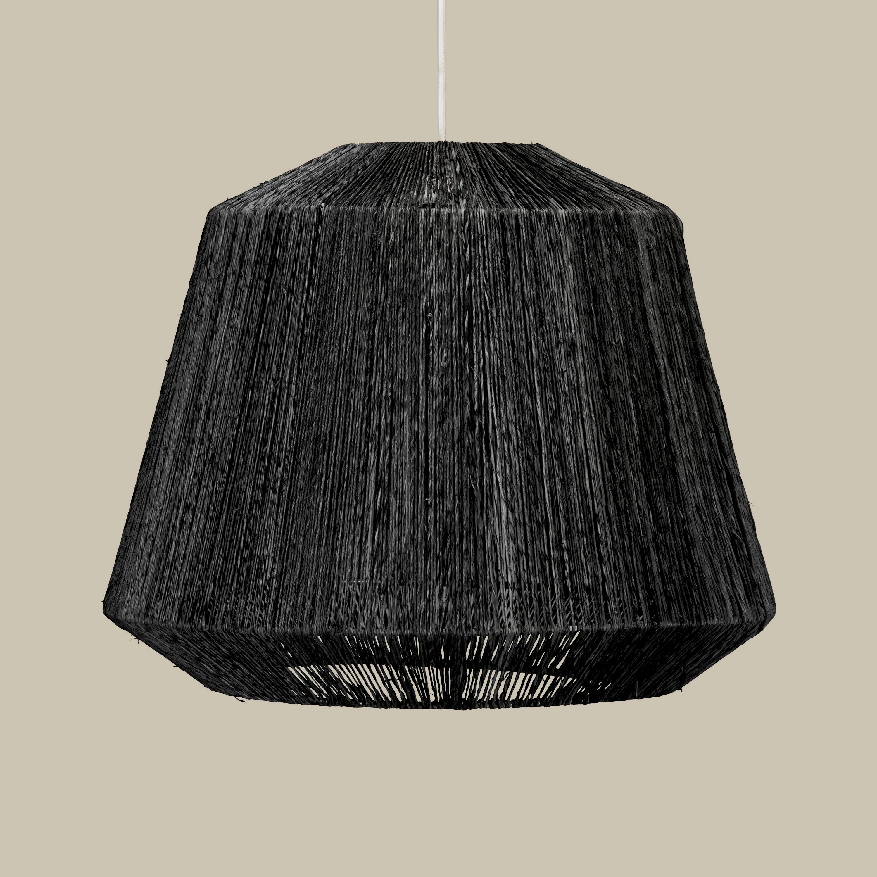 Manhattan Jute Pendant in Black on a beige background at Addison West