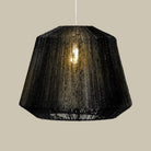Manhattan Jute Pendant in Black on a beige background at Addison West