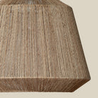 Close up of Manhattan Jute Pendant in Natural on a beige background at Addison West