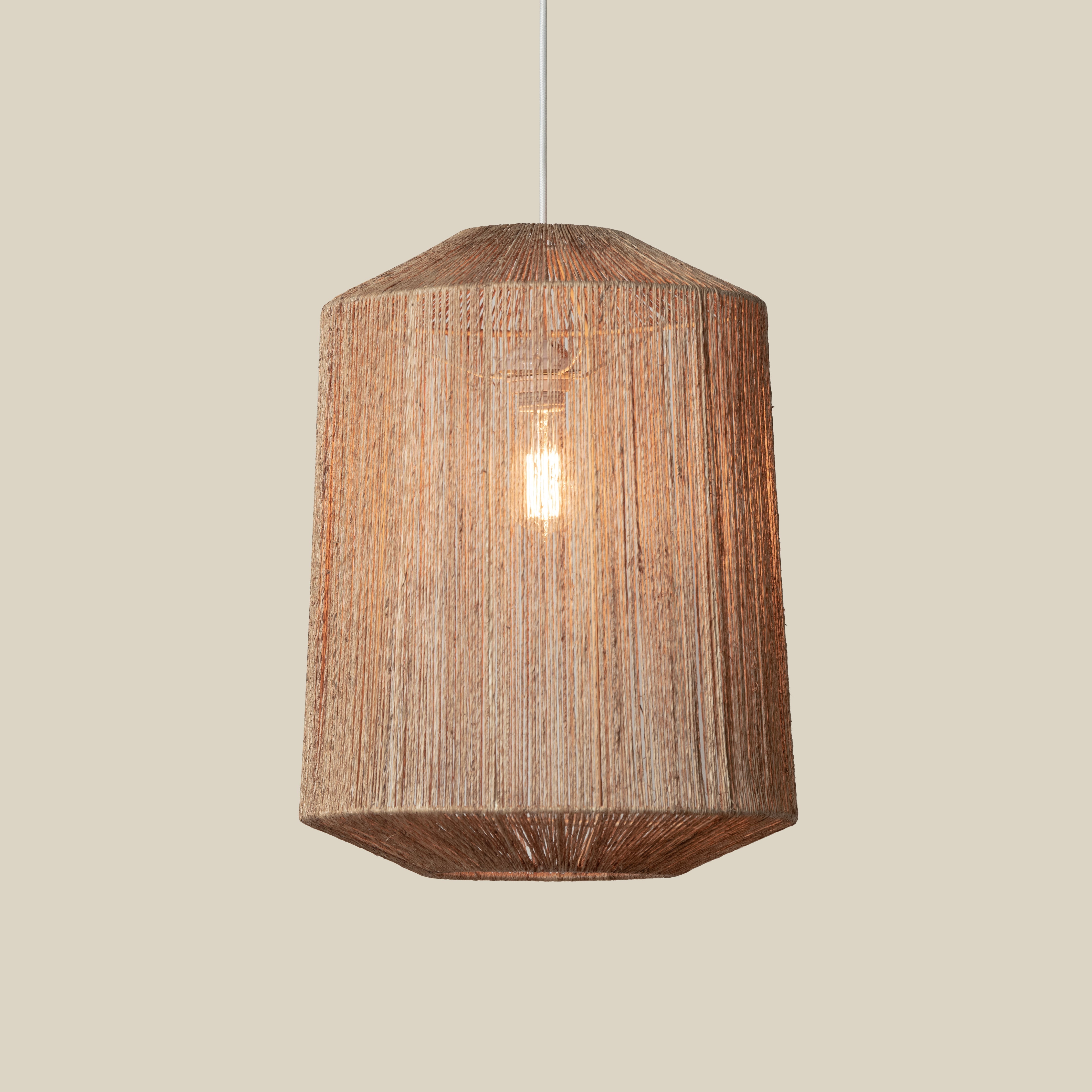 Walker Pendant on a beige background at Addison West