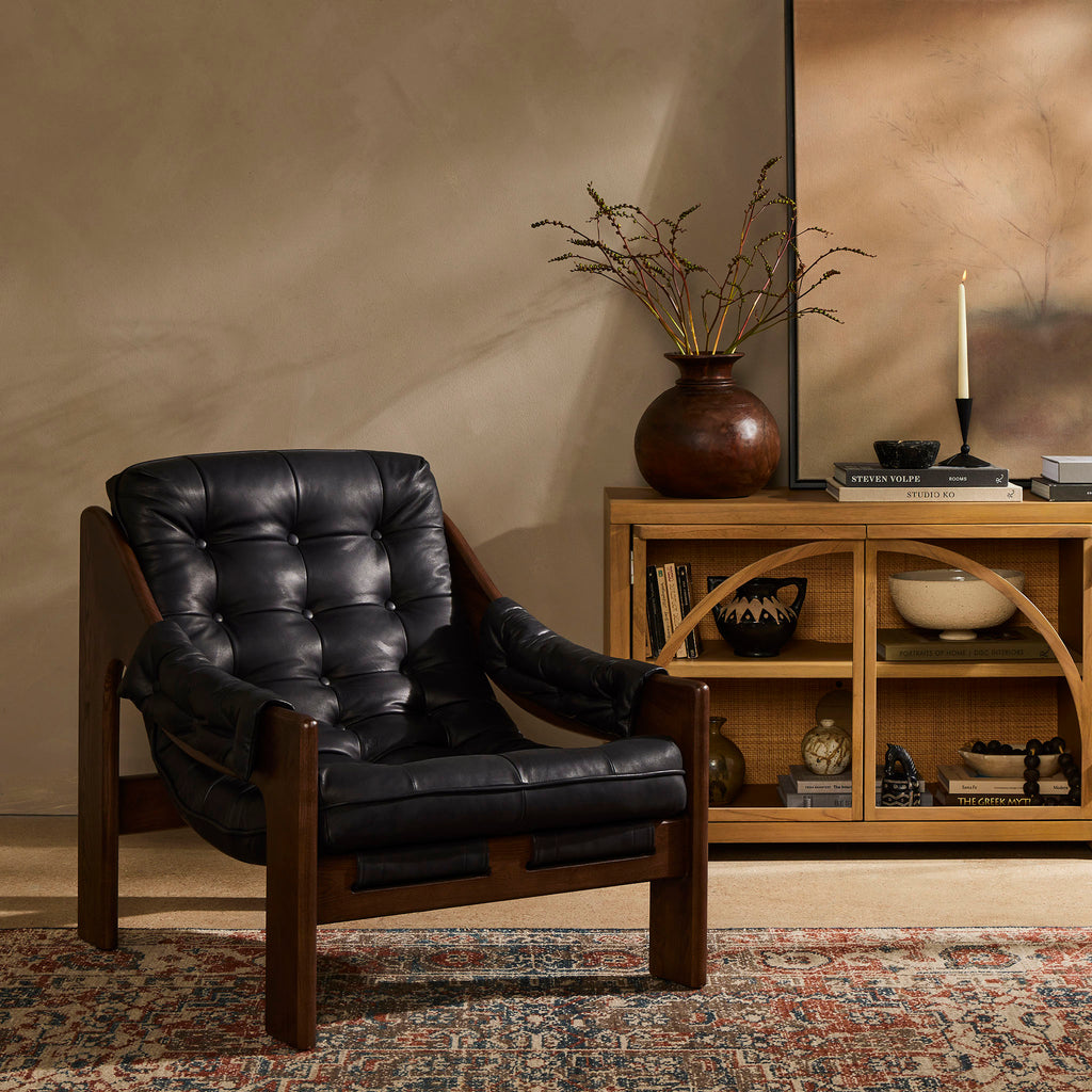 Four Hands Furniture leather sling Halston Chair in Heirloom Black in a taupe and moody living space