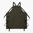 Hedley & Bennett All Day Crossback Apron in Olive on plain background at Addison West.