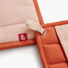 Hedley & Bennett Paprika Pot Holders on plain background at Addison West.