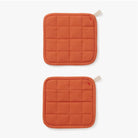 Hedley & Bennett Paprika Pot Holders on plain background at Addison West.