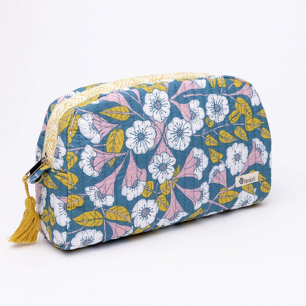 Zippered cosmetic bag with white flowers and blue on a white background