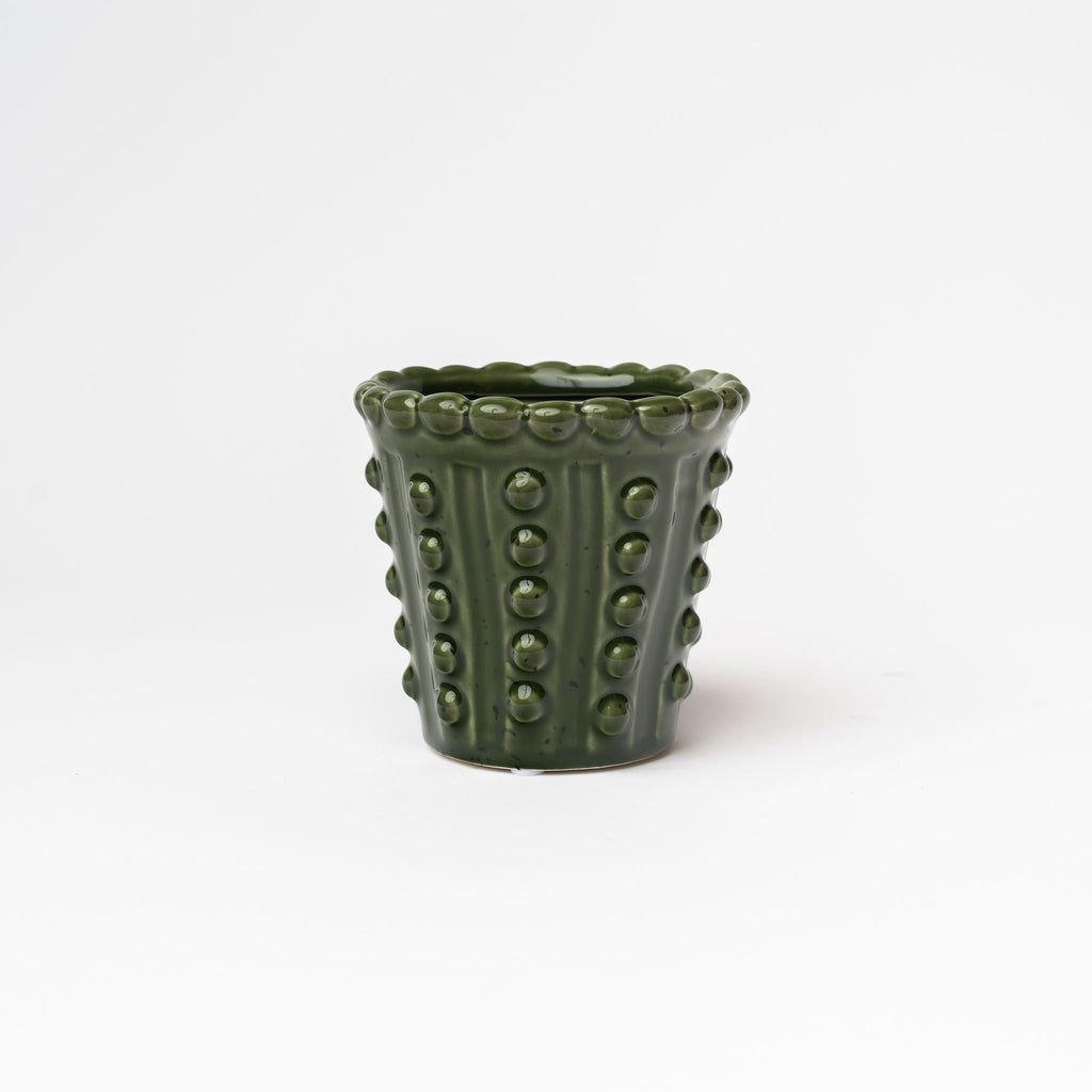 Small Green planter with hobnail pattern on a white background