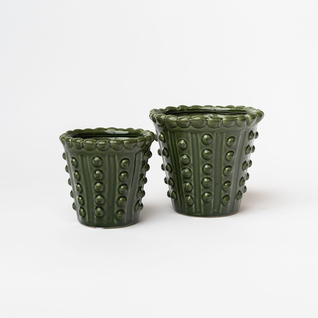 Set of two Green planters with hobnail pattern on a white background