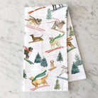 Holiday Ski Dogs Tea Towel on a marble kitchen counter at Addison West