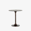 Antique rust colored 'Simone' metal counter height tulip table by four hands furniture on a white background