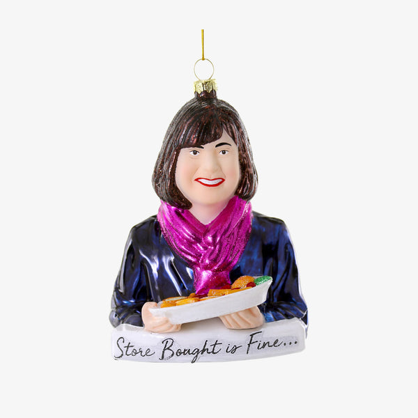 Ina Garten painted glass holiday ornament with quote "store bought is fine.." on a white background