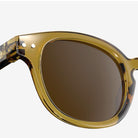 Izipizi #C Golden Green Sunglasses on a white background at Addison West