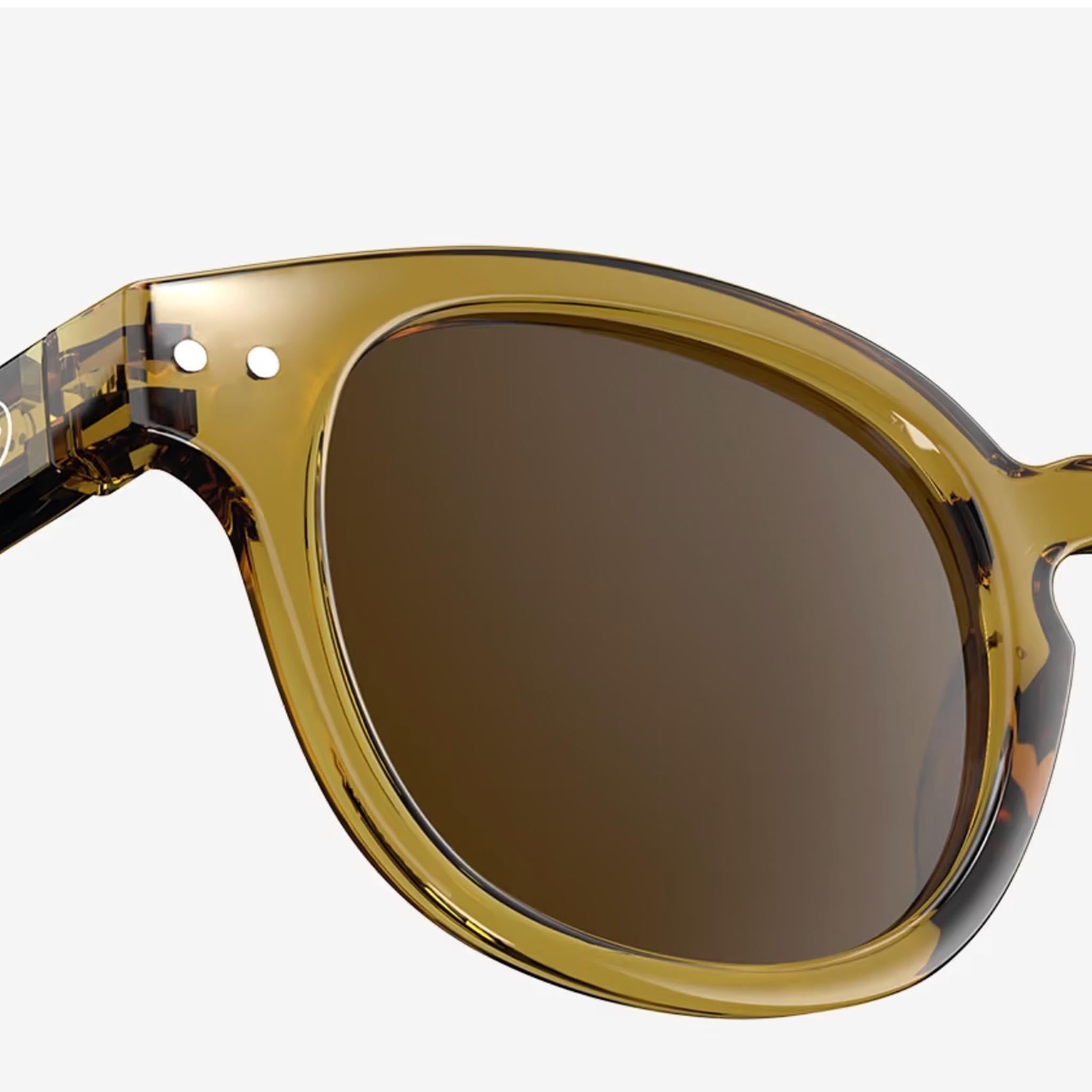 Izipizi #C Golden Green Sunglasses on a white background at Addison West