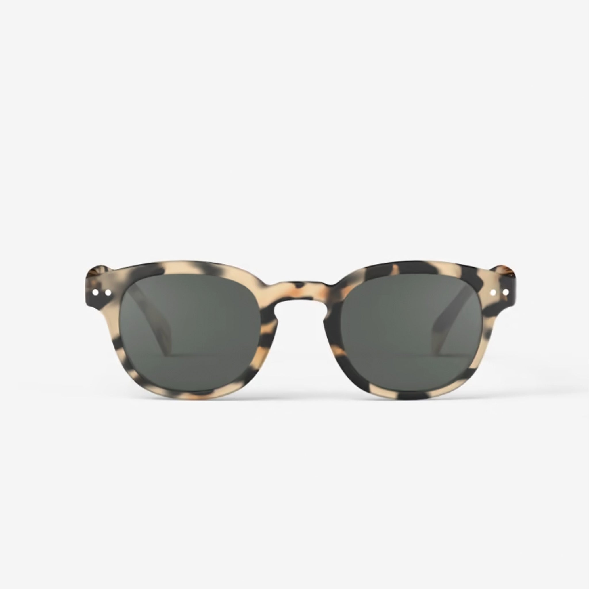 Izipizi #C Light Tortoise Sunglasses on plain background at Addison West.