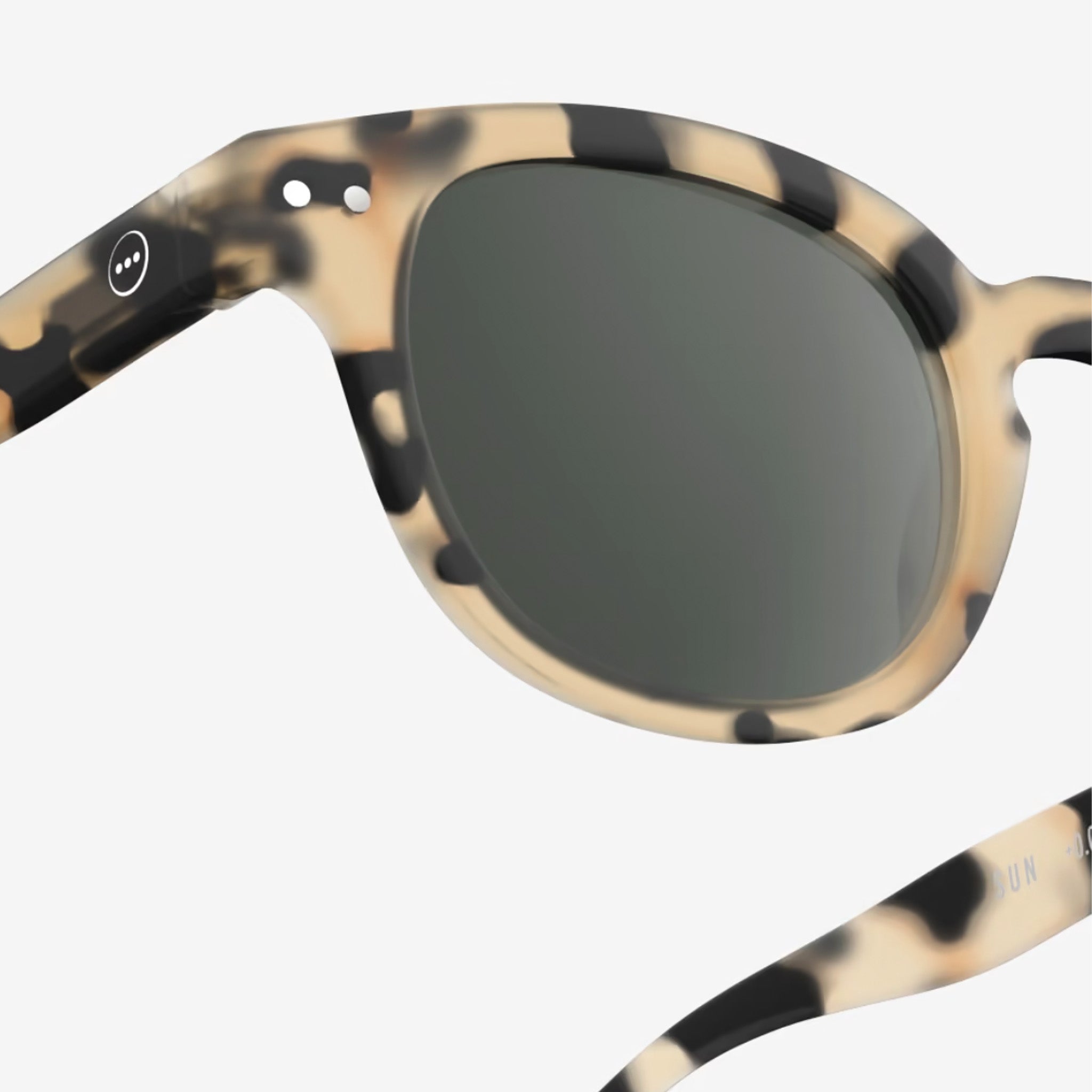 Izipizi #C Light Tortoise Sunglasses on plain background at Addison West.
