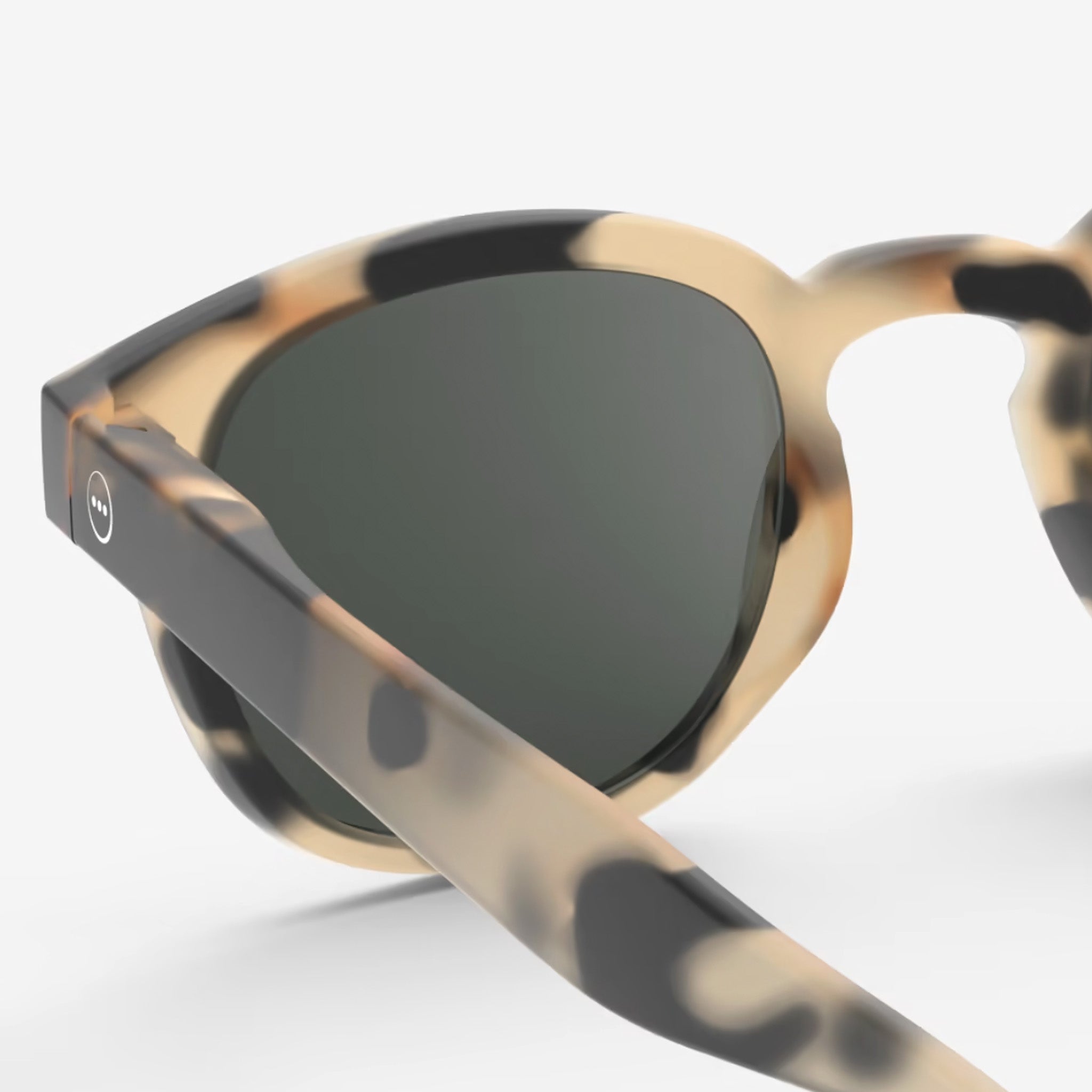 Izipizi #C Light Tortoise Sunglasses on plain background at Addison West.