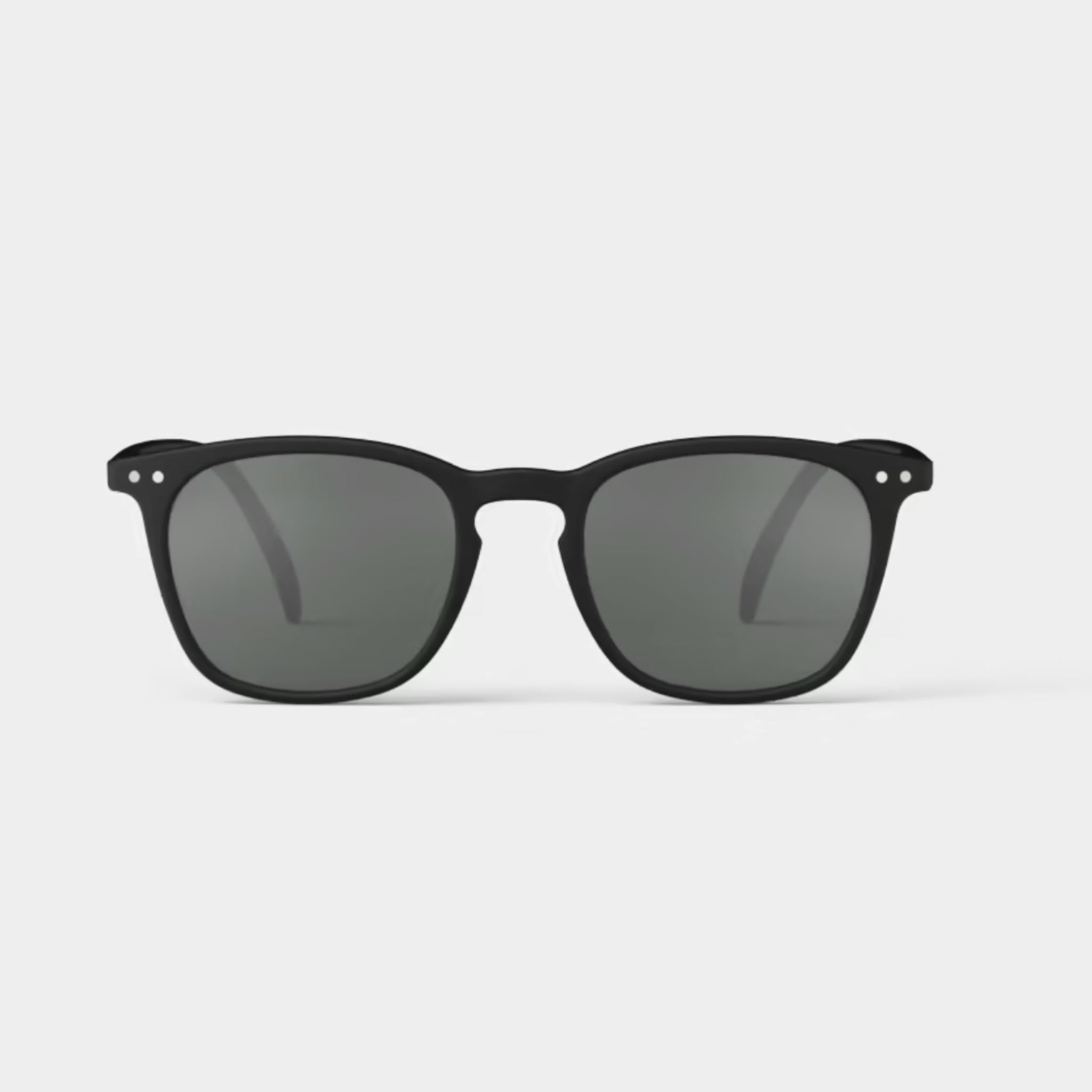 Izipizi #E Black Sunglasses on a white background at Addison West