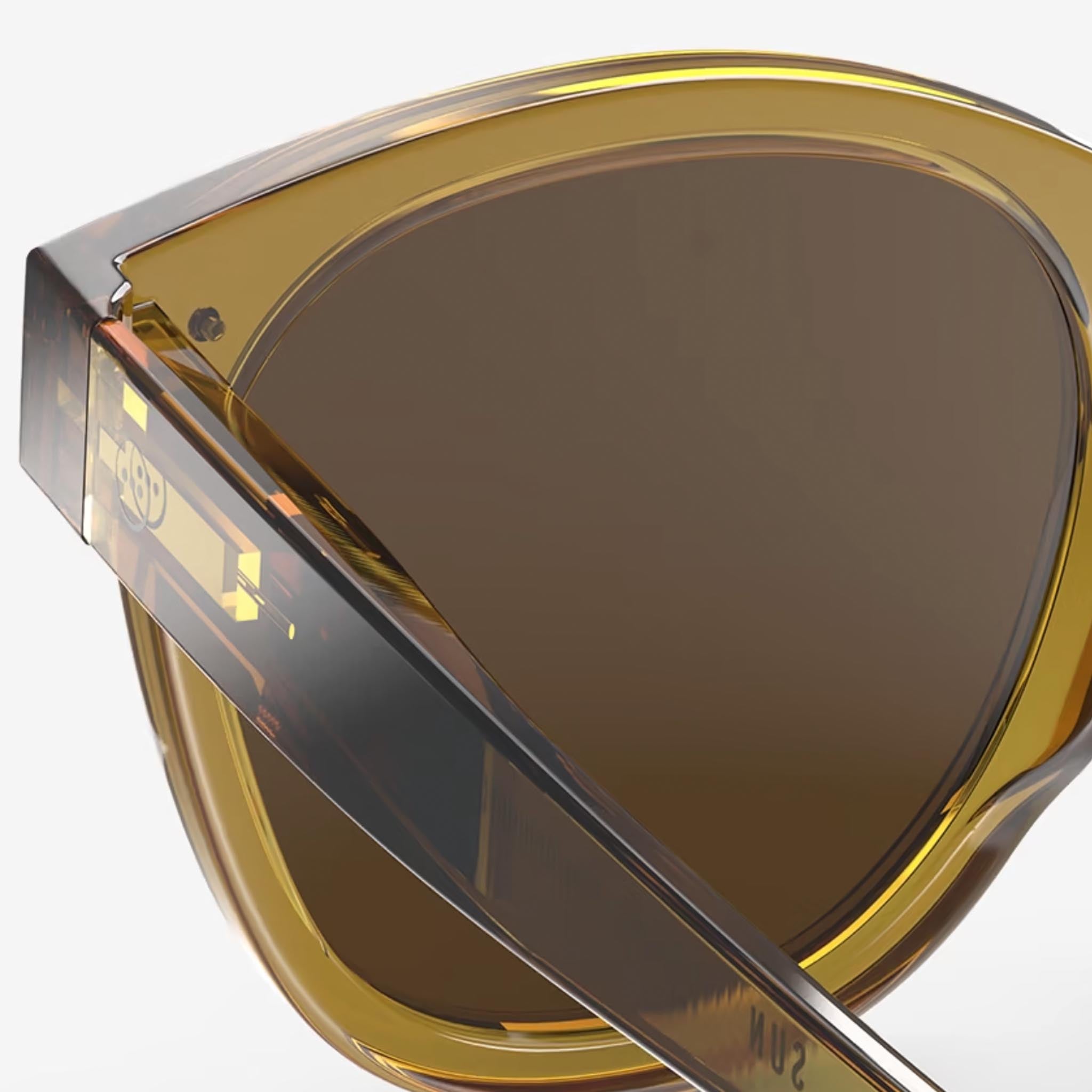 Izipizi #N Golden Green Sunglasses on a white background at Addison West