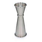 Stainless steel japanese style cocktail jigger on a white backrgound