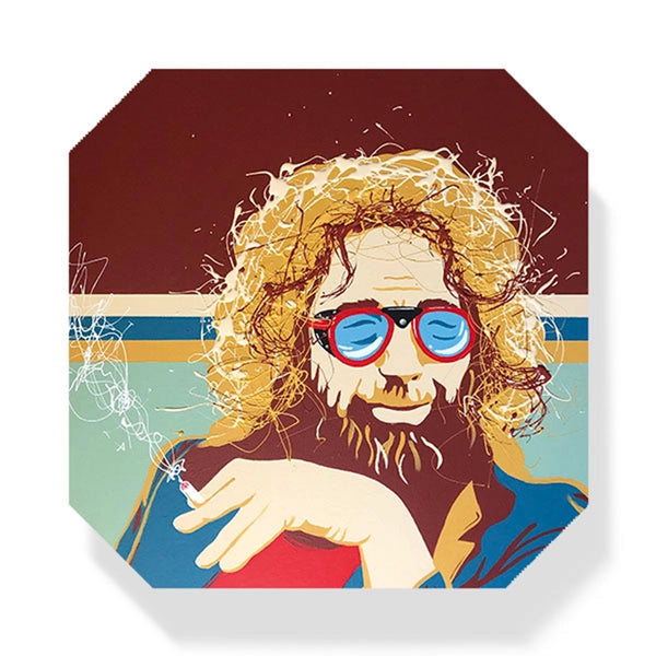 Square coaster with illustration of Jerry Garcia wearing ski goggles by Shannon Henn on a white background