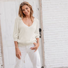Wooden Ships Justine 3/4 Sleeve V Top Mercer in Half Moon on a model in front of a while wall at Addison West