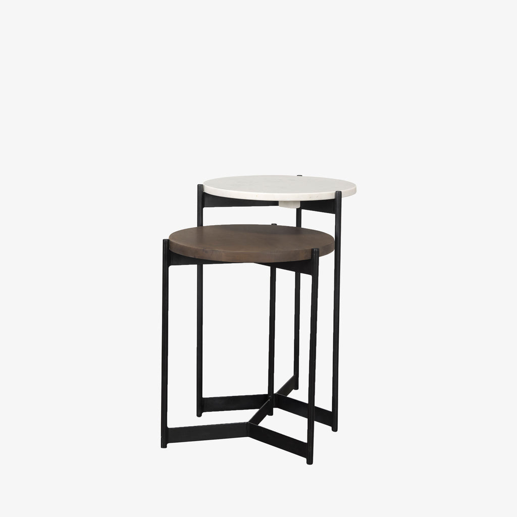 Round nesting side tables with black frames on a white background